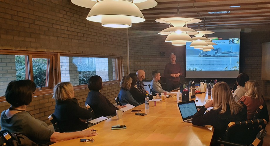 Man giving a presentation for a group of people.